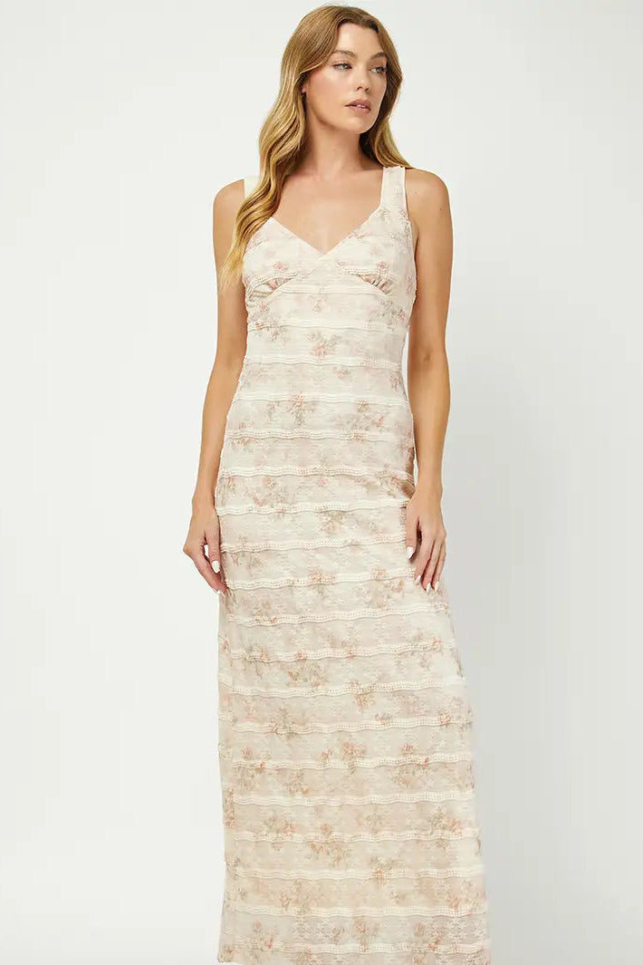 Woman wearing a floral patterned dress on a white background