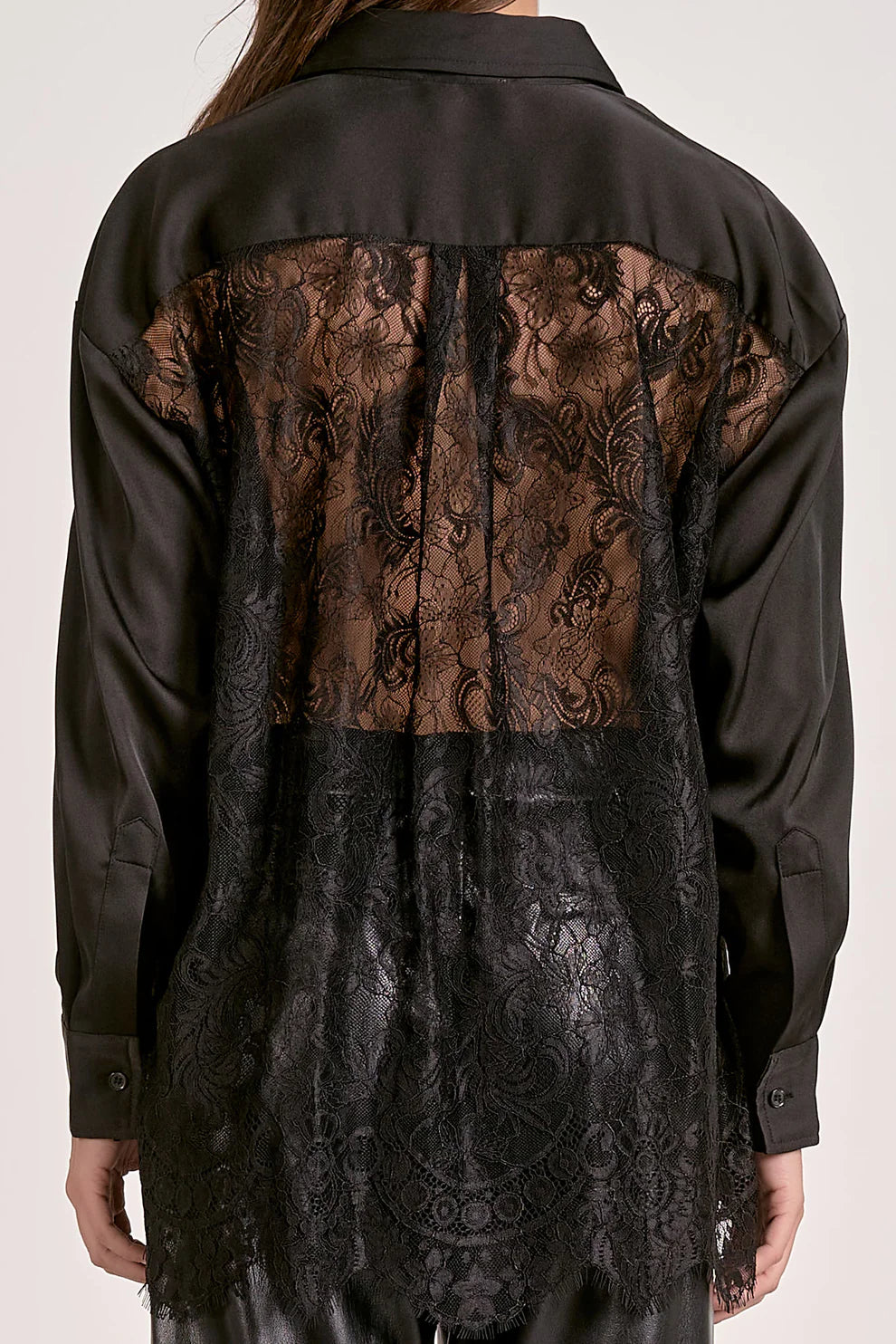 Black lace overlay on a plain background