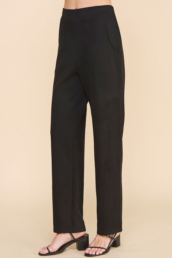 Black pants on a beige background