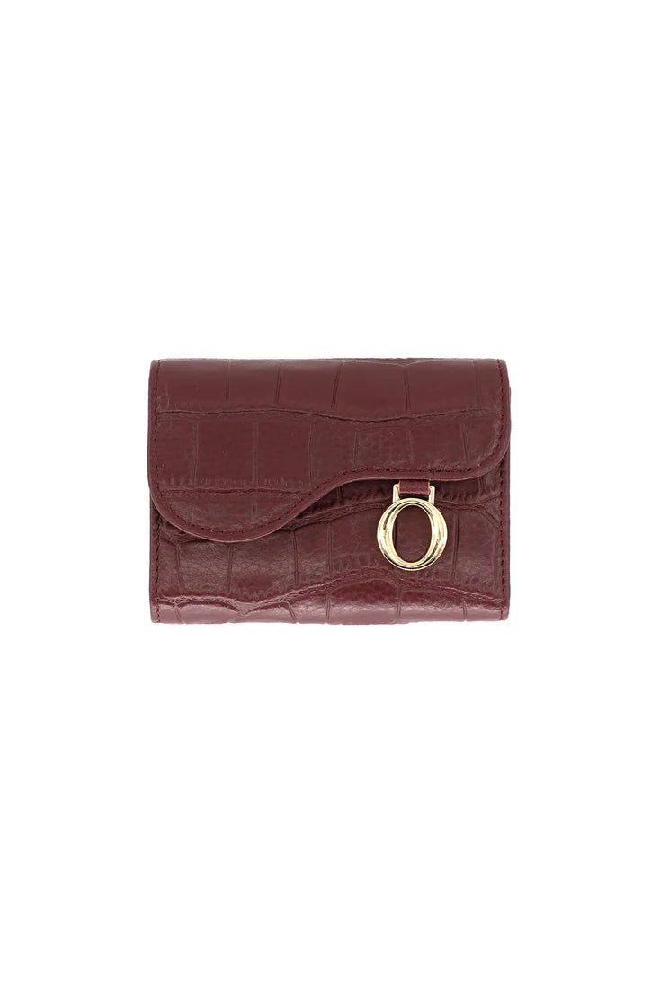 Brown wallet with gold ring on a white background