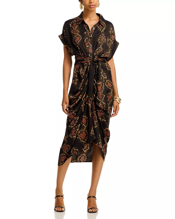 Woman wearing a patterned dress on a white background