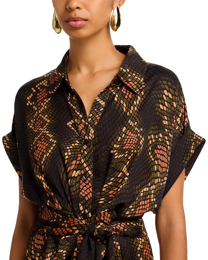 Woman wearing a patterned dress on a white background