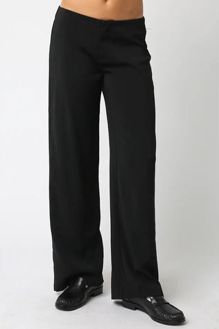 Black wide-leg pants worn by a person on a white background