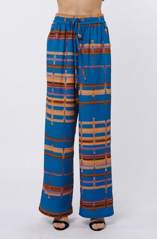 Blue patterned pants on a white background