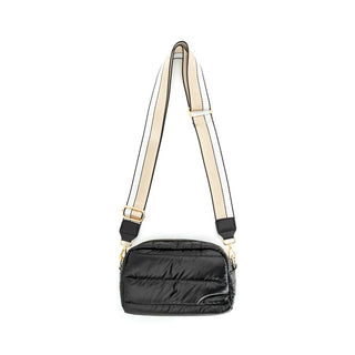 Black puffer bag with beige strap on a white background