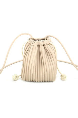 Beige pleated drawstring bag on a white background