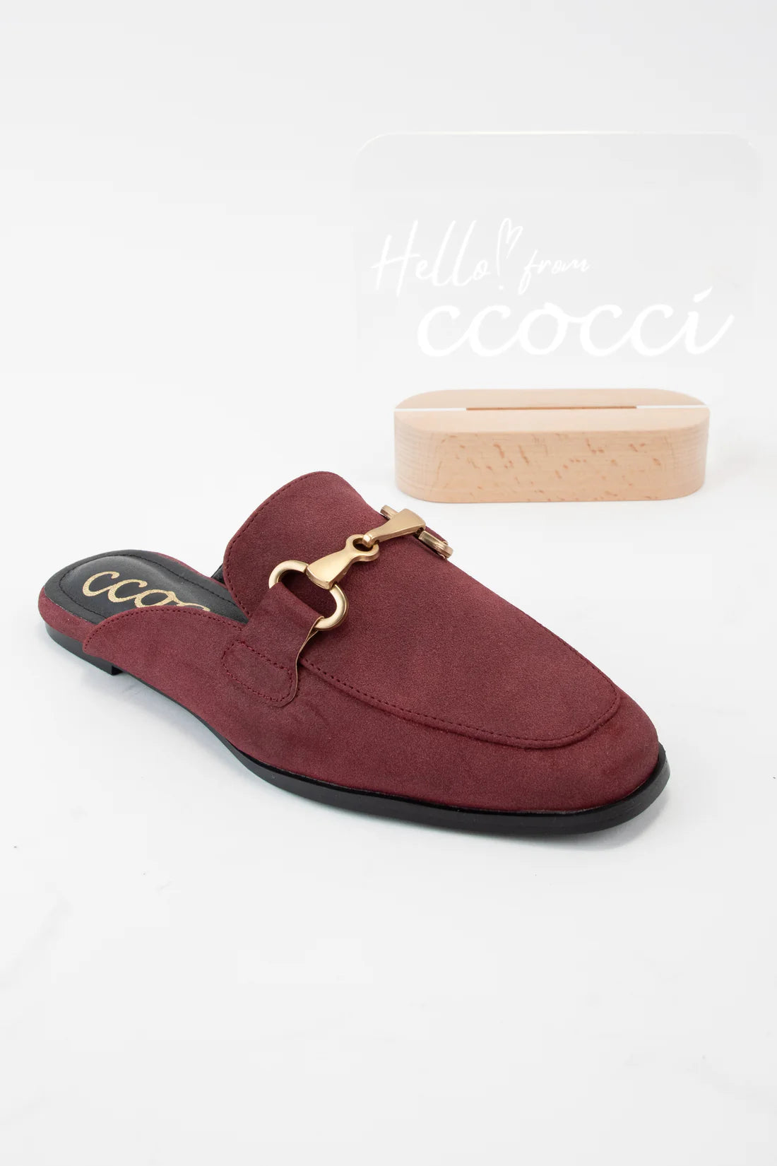 Maroon slip-on shoe with gold buckle on a white background, featuring the brand 'cccoo'.