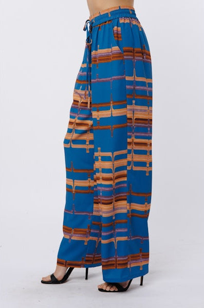 Blue patterned pants on a white background