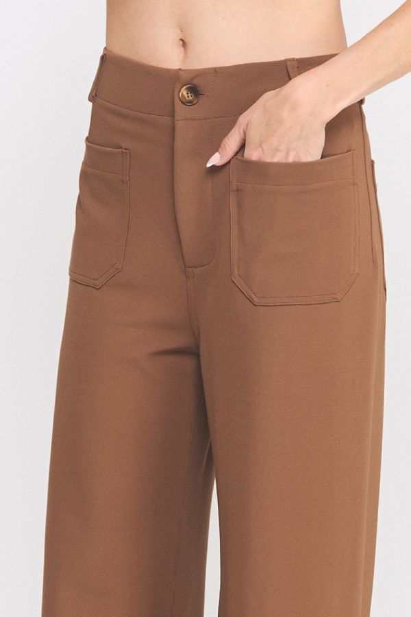 Brown pants with a button on a white background