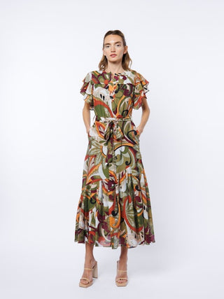 Woman wearing a patterned dress on a white background