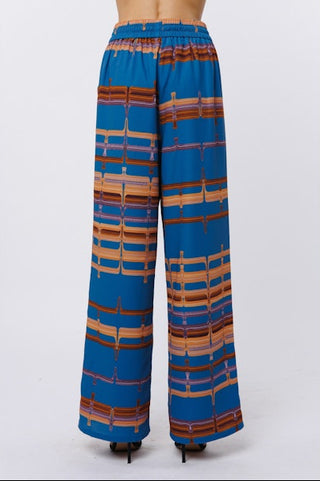 Blue patterned pants on a white background