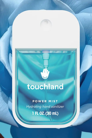 Touchland hand sanitizer with blue design on a blue floral background