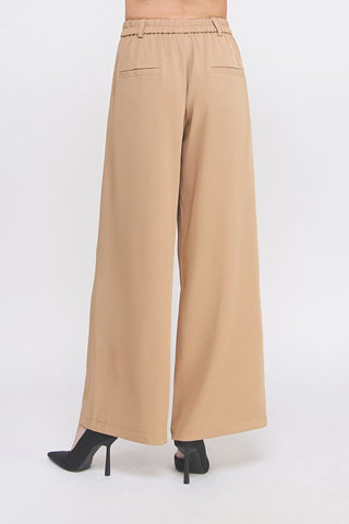 Beige wide-leg pants on a white background