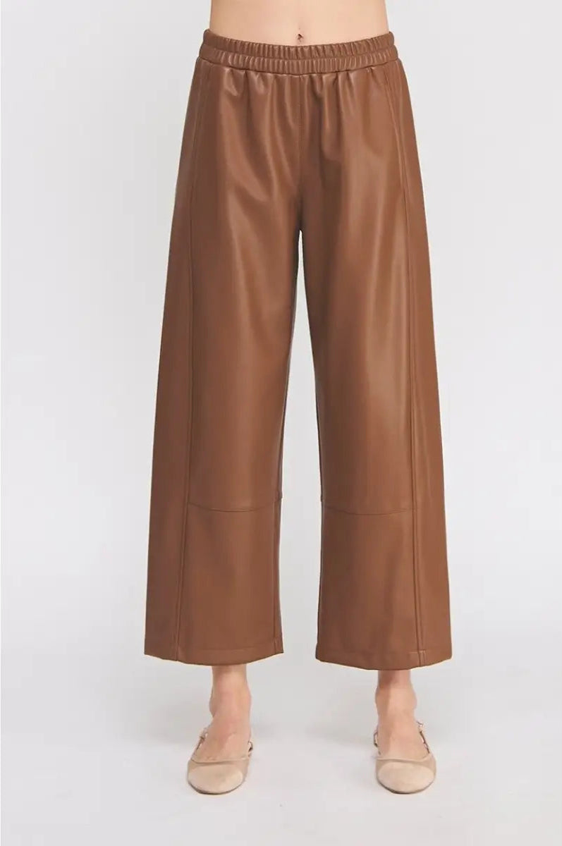 Brown leather pants on a white background