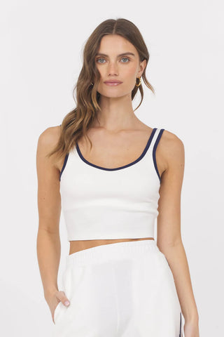 A female model wearing a white cropped tank top STMT BOUTIQUE 