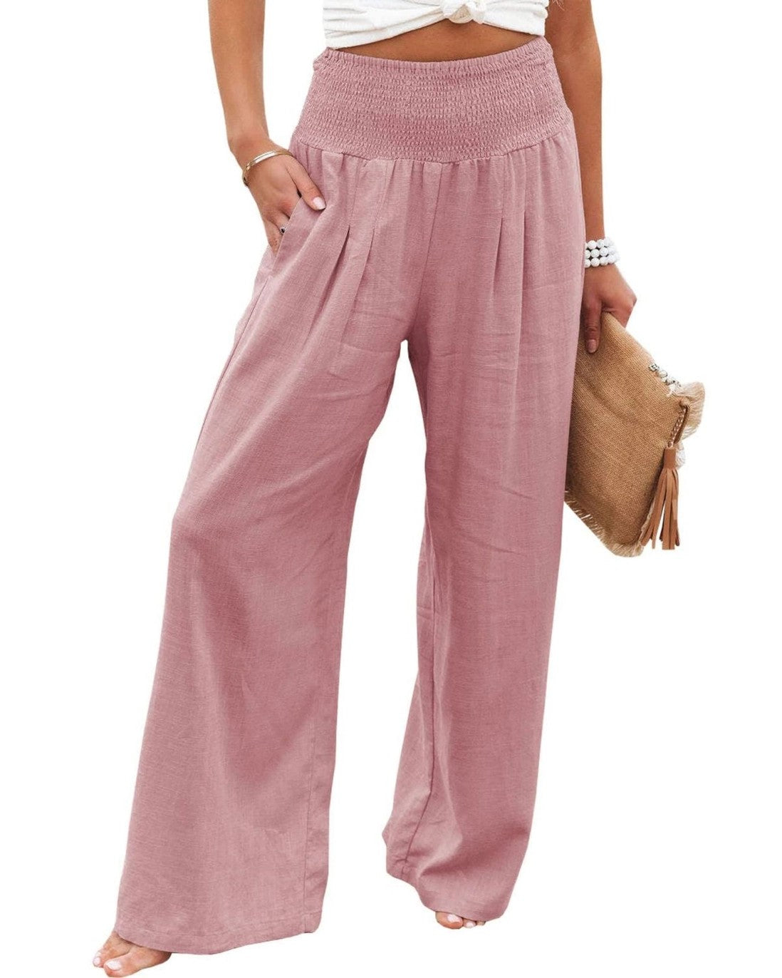 A pair of mid-rise, wide-leg gray cotton slacks with a smocked waistband STMT BOUTIQUE 