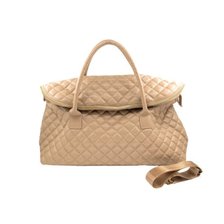 Beige quilted handbag with a detachable strap on a white background