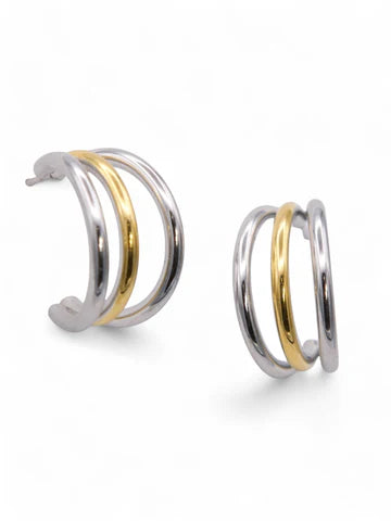 Pair of hoop earrings with gold and silver finish on a white background