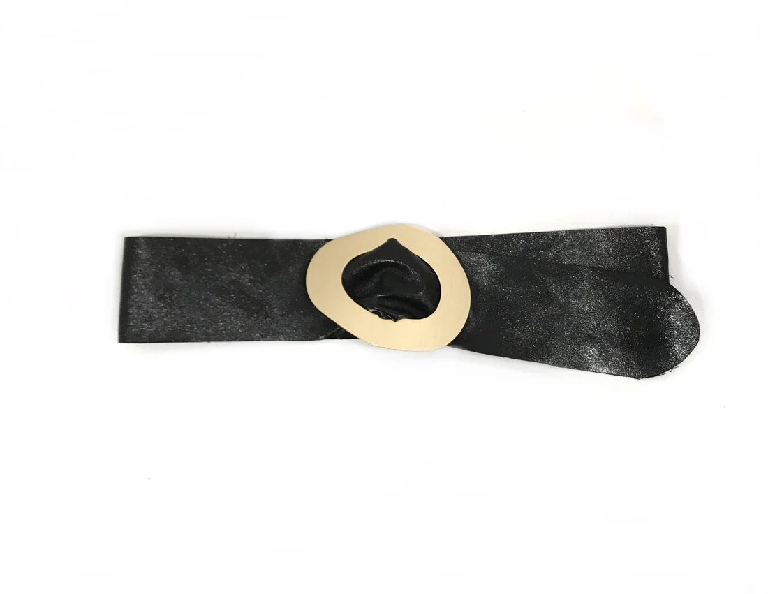 Black belt with a gold buckle on a white background