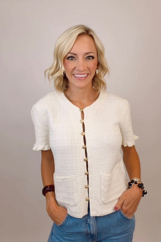 RUFFLED SHORT SLEEVE SWEATER TOP WITH FRONT POCKETS