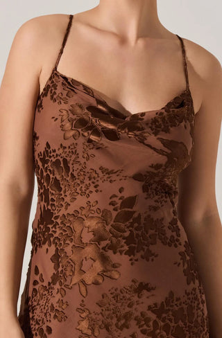 Brown floral dress on a plain background
