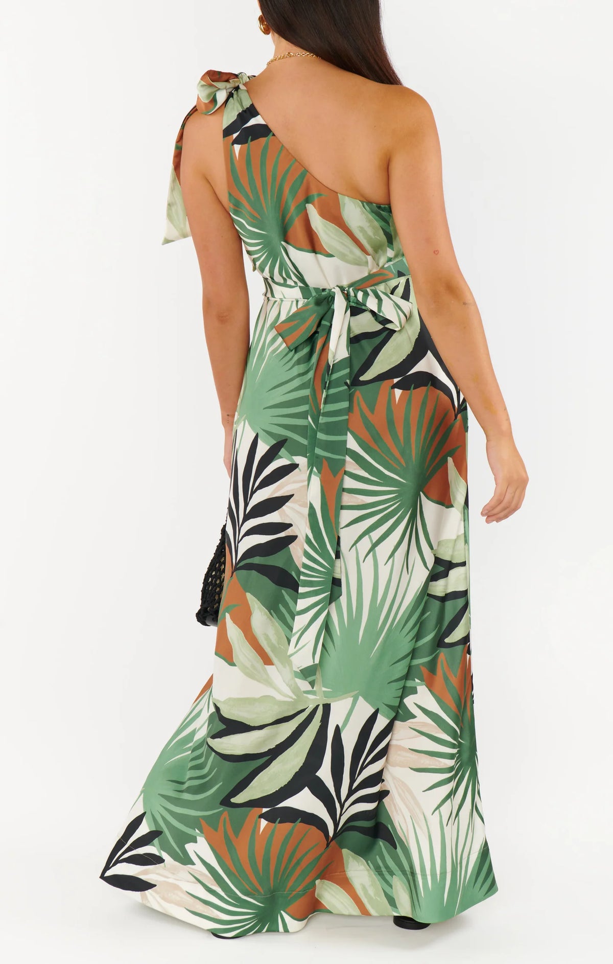 Tropical leaf patterned dress on a white background