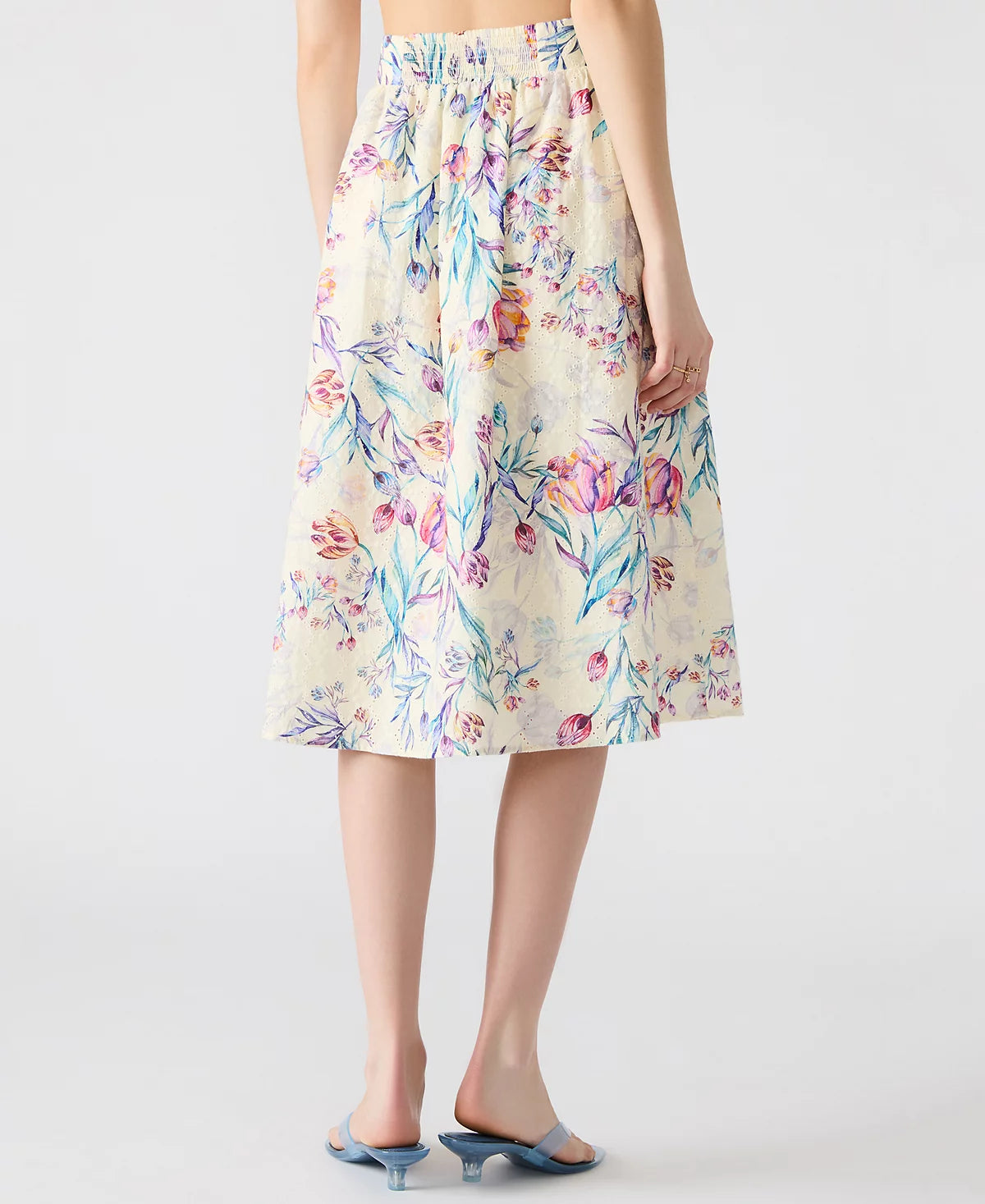 Woman wearing Carlynn skirt with blouse