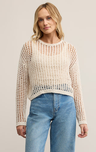 Woman wearing a beige mesh sweater STMT BOUTIQUE 