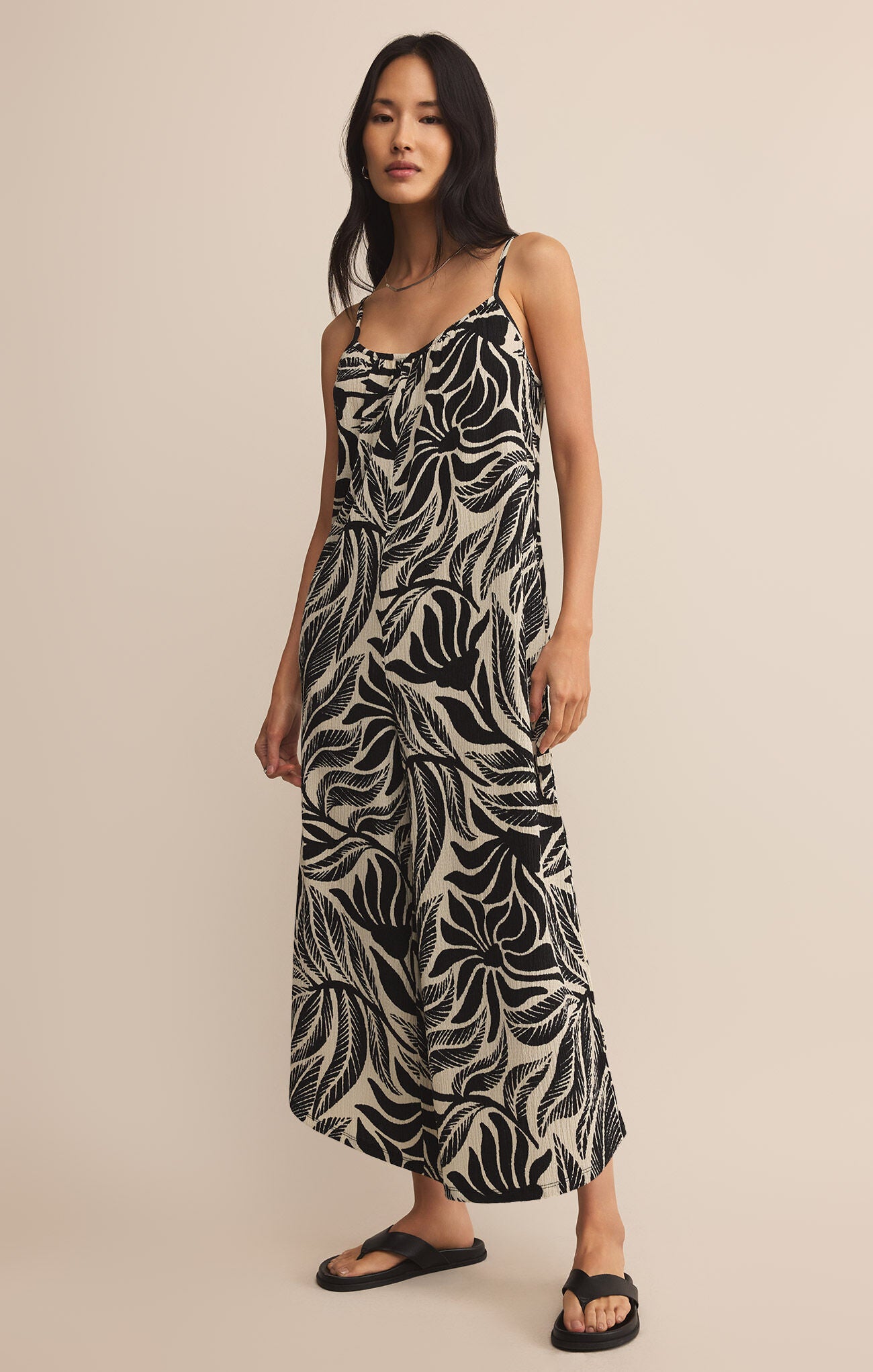 Woman wearing a black and white patterned jumpsuit STMT BOUTIQUE 