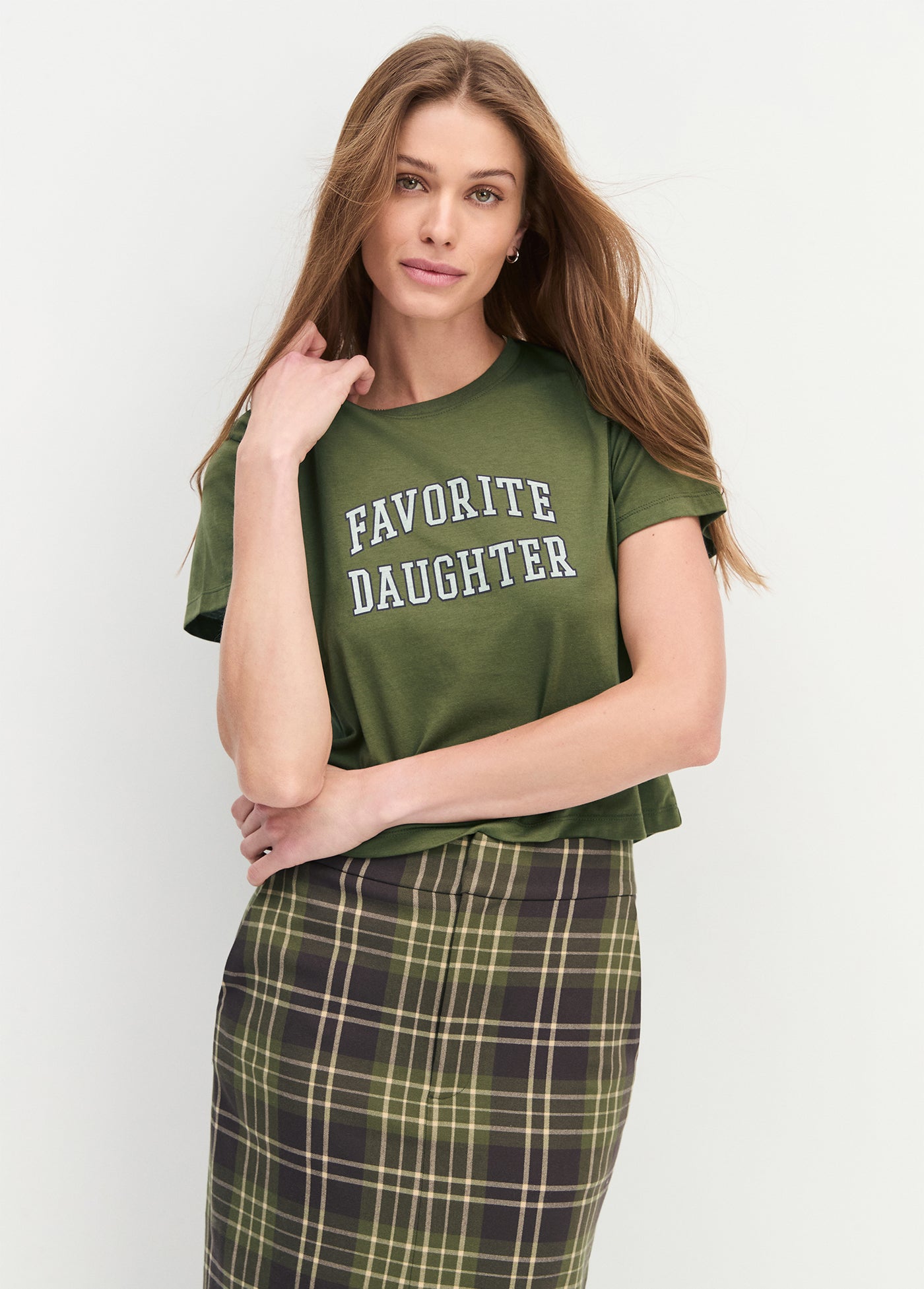 Woman wearing a green t-shirt