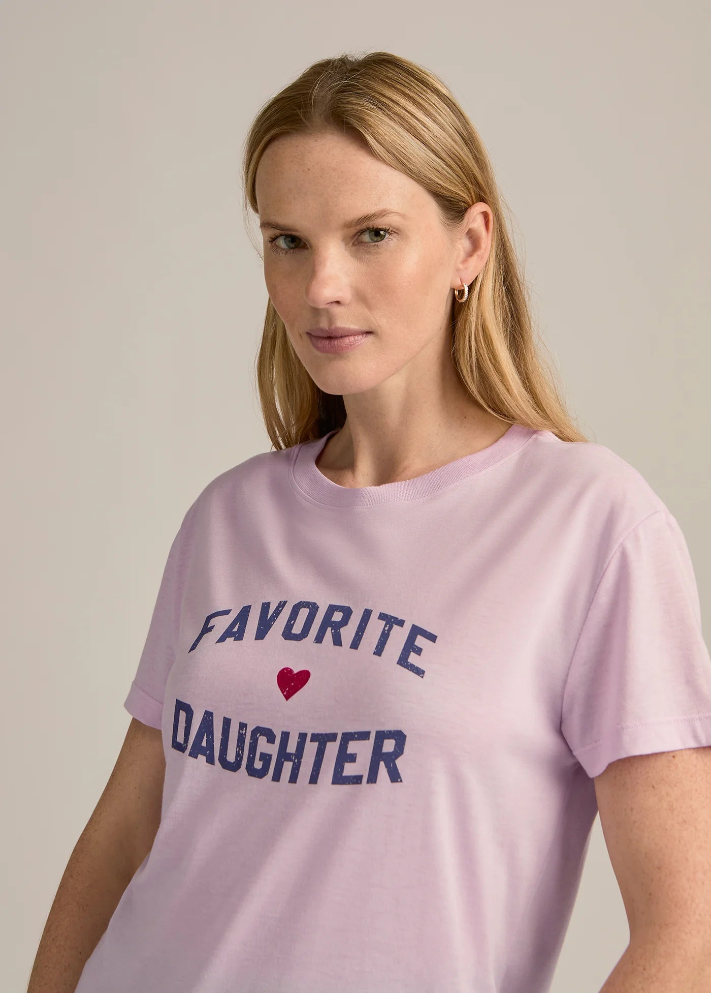 Woman wearing a pink t-shirt STMT BOUTIQUE 