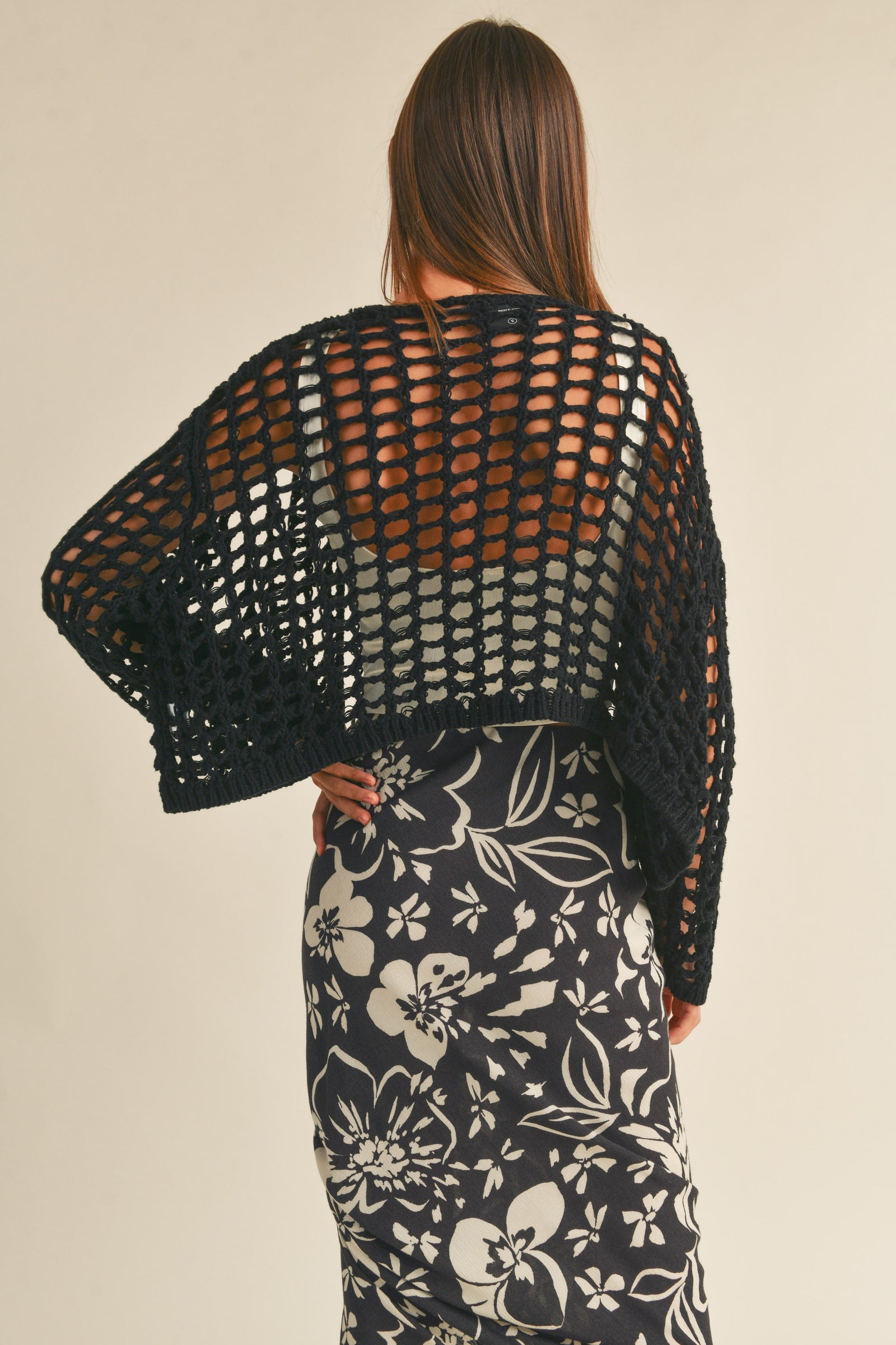  Woman wearing crochet knit crop 