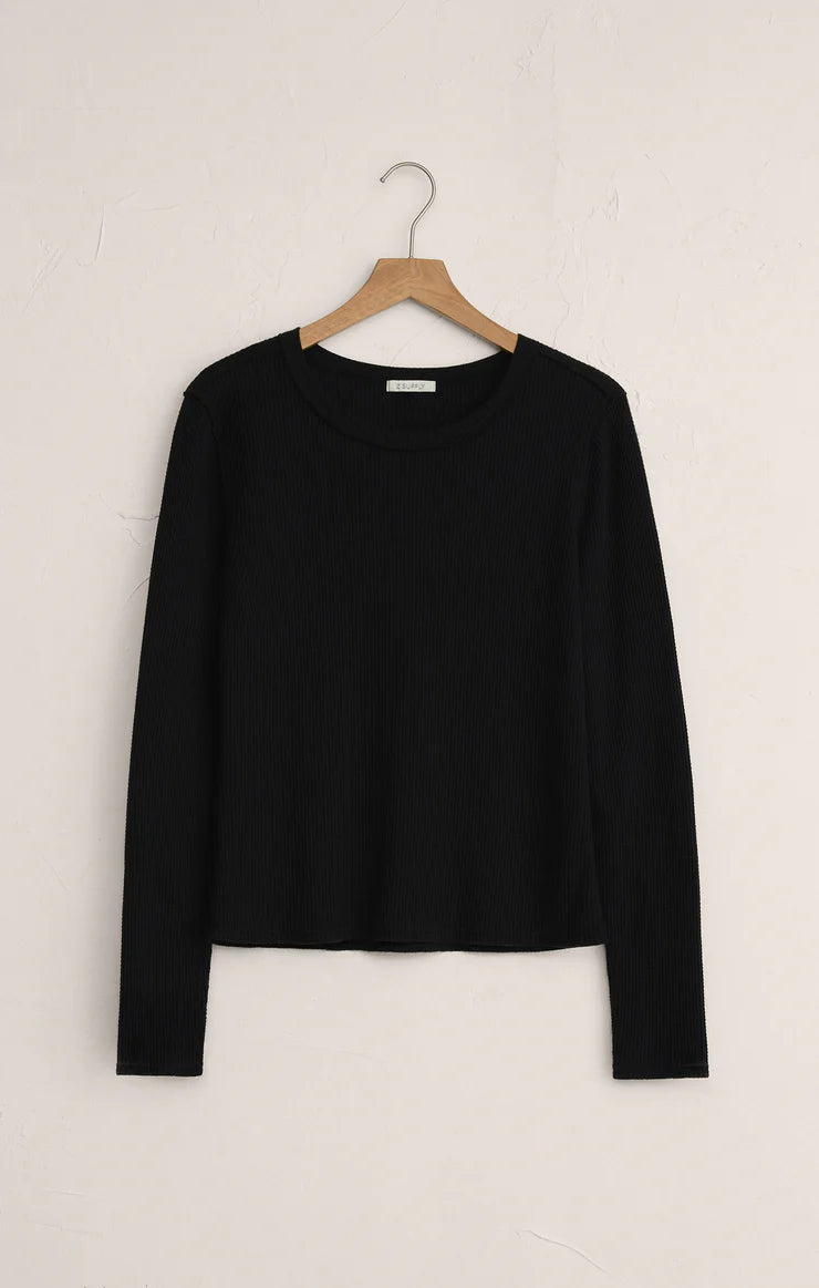 Black long-sleeve shirt on a wooden hanger against a white background