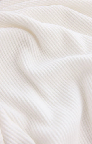 Close-up of white fabric with a subtle texture