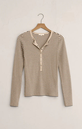 Striped long-sleeve shirt on a hanger against a white background