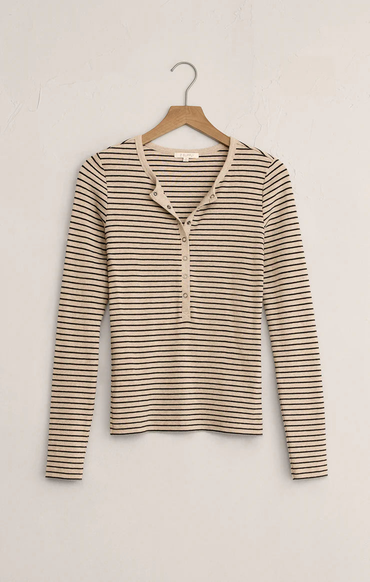Striped long-sleeve shirt on a hanger against a white background
