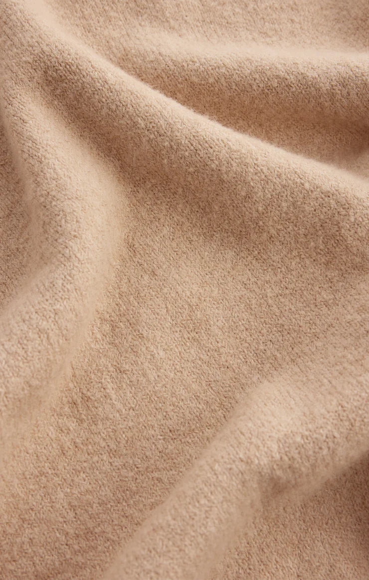 Close-up of beige fabric with a soft texture