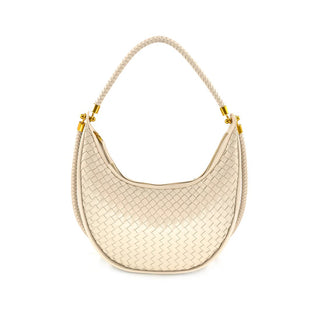 Beige woven handbag with gold hardware on a white background