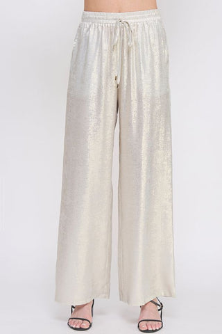 Beige wide-leg pants on a white background