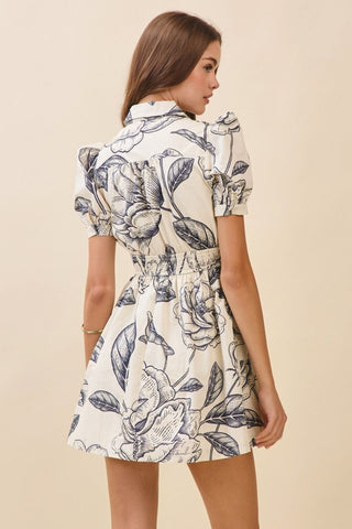 Woman wearing a floral dress on a beige background