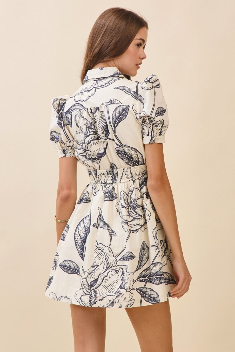 Woman wearing a floral dress on a beige background