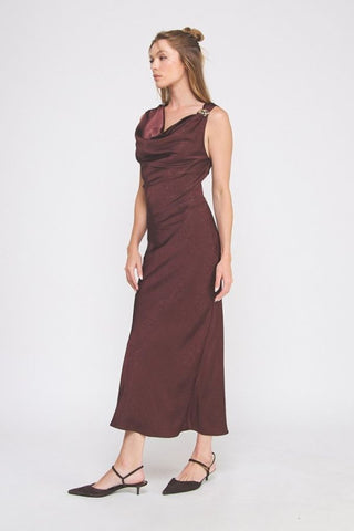 Woman wearing a brown dress on a white background