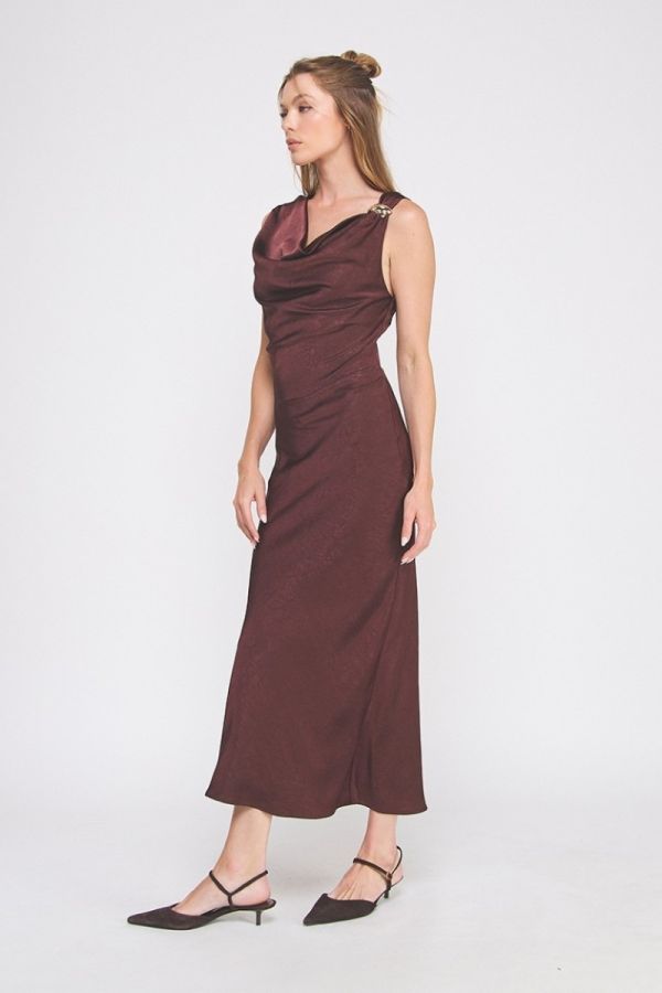 Woman wearing a brown dress on a white background