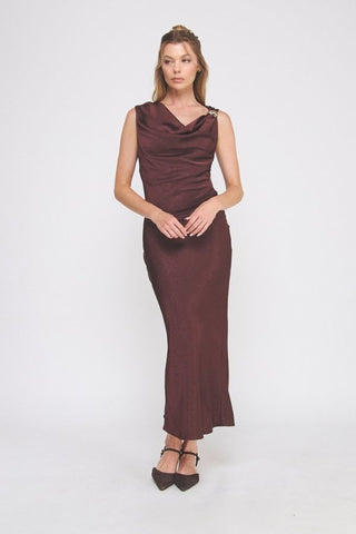 Woman wearing a burgundy evening gown on a white background