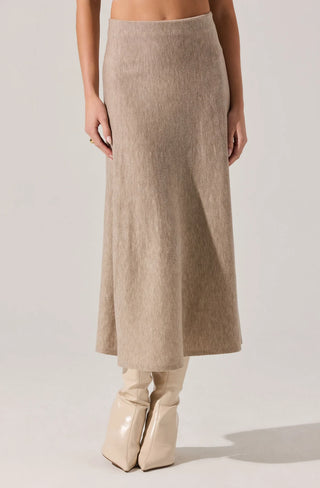 Beige skirt worn by a person on a plain background