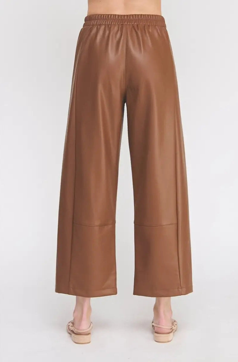Brown leather pants on a white background