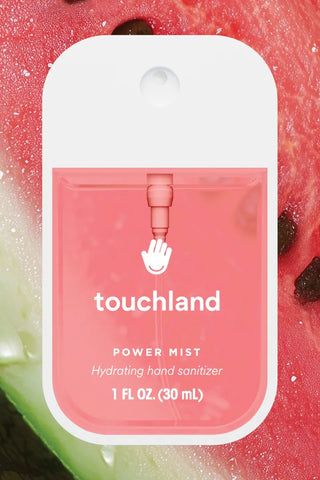 Touchland power mist hand sanitizer packaging with a watermelon background