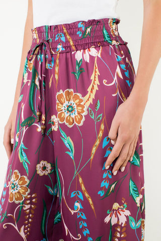 Floral-patterned pants with a white background