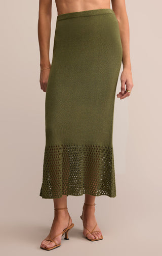 Olive green skirt with lace hem on a beige background