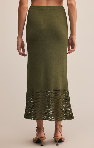 Green skirt with lace hem on a neutral background